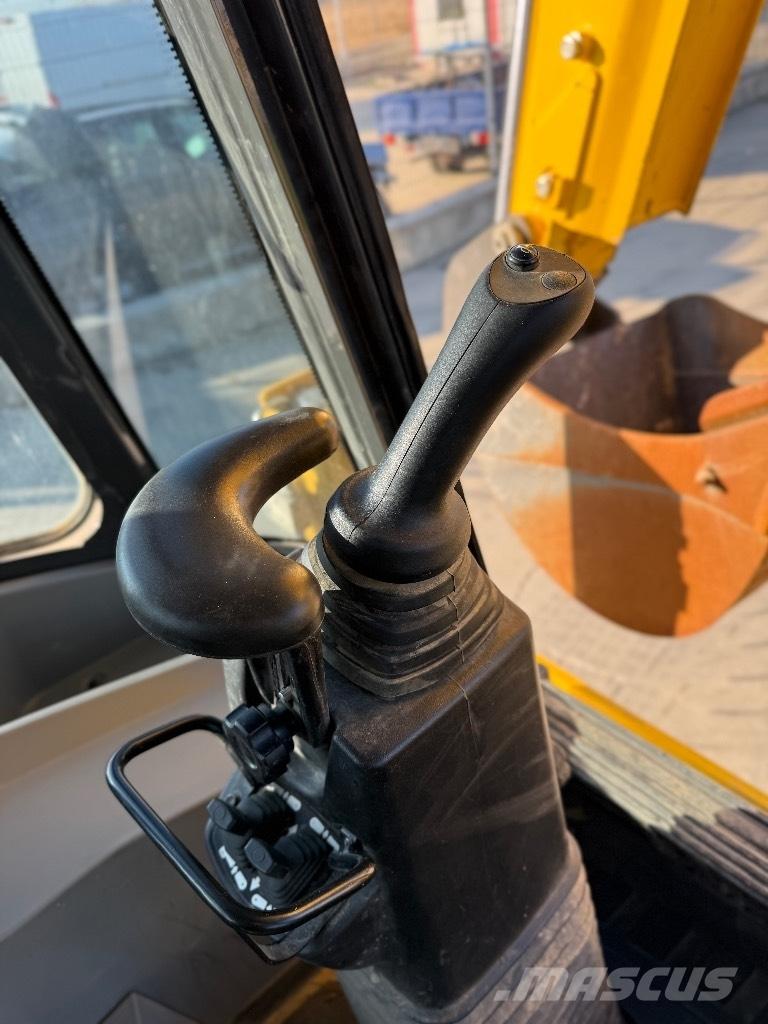 New Holland B 115 Rovokopači