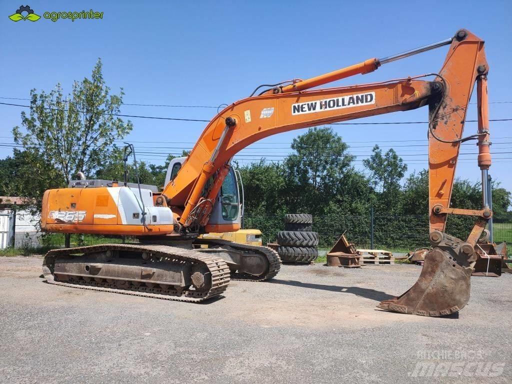 New Holland E 265 Bageri guseničari