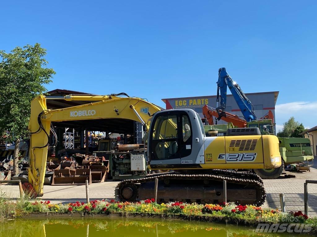 New Holland E 215 Bageri guseničari