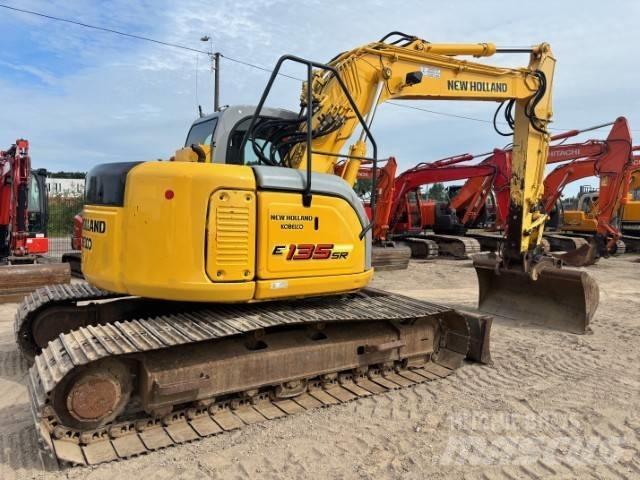New Holland E 135 SR Bageri guseničari