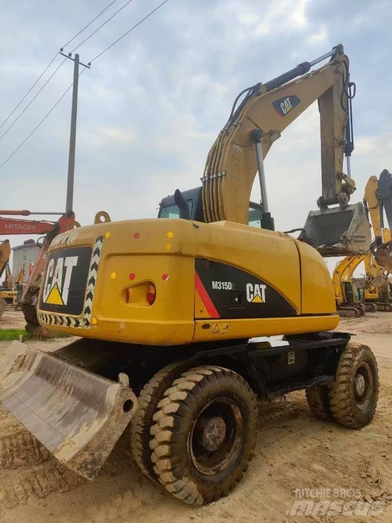 CAT M315D2 Bageri guseničari