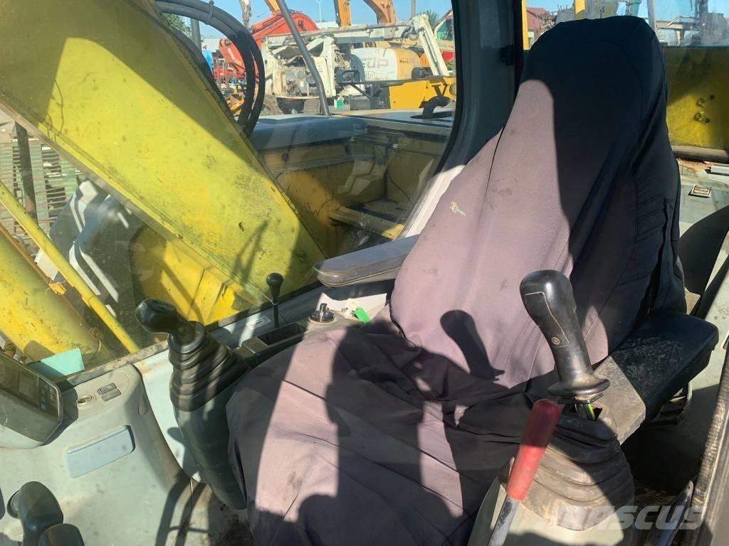 New Holland E 135 SR Bageri guseničari