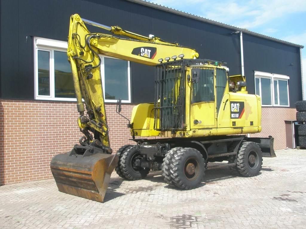 CAT M318F Bageri točkaši