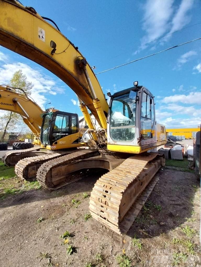 New Holland E 305 Bageri guseničari