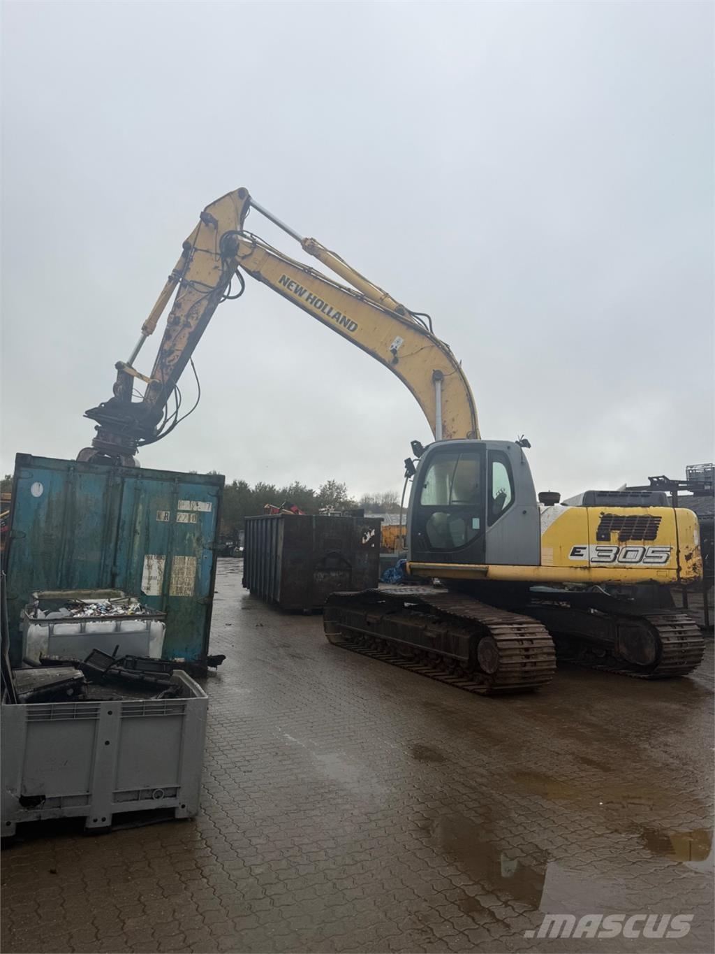 New Holland E305 Bageri guseničari