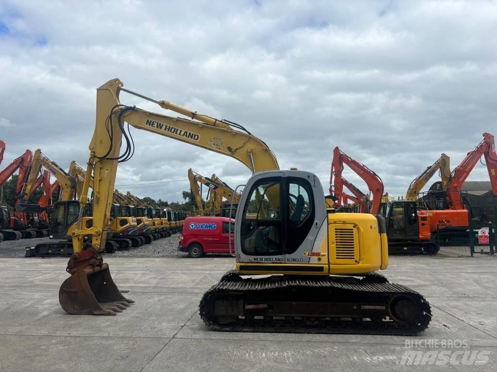 New Holland E 135 SR Bageri guseničari