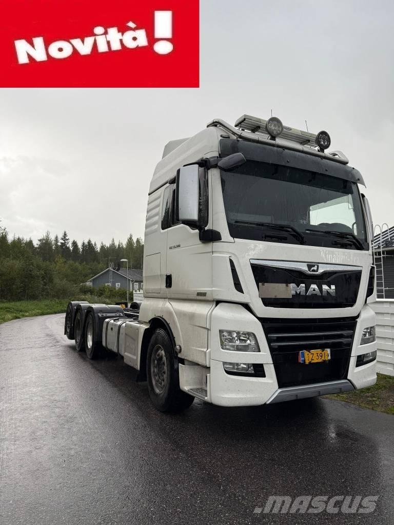 MAN TGX 32.580 Kamioni sa ravan platformom / vitlom