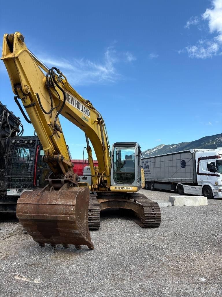 New Holland E 245 B Bageri guseničari