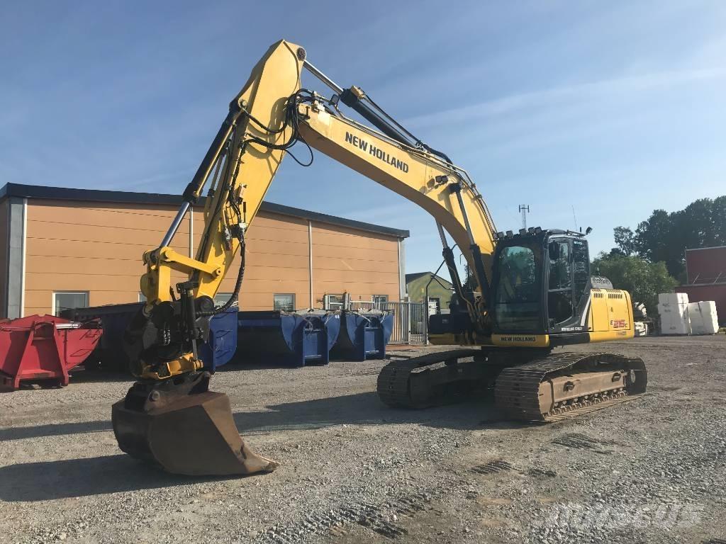 New Holland E 215 C Bageri guseničari