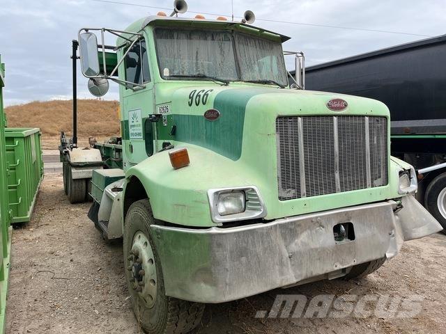 Peterbilt 330 Rol kiper kamioni sa kukom za podizanje tereta